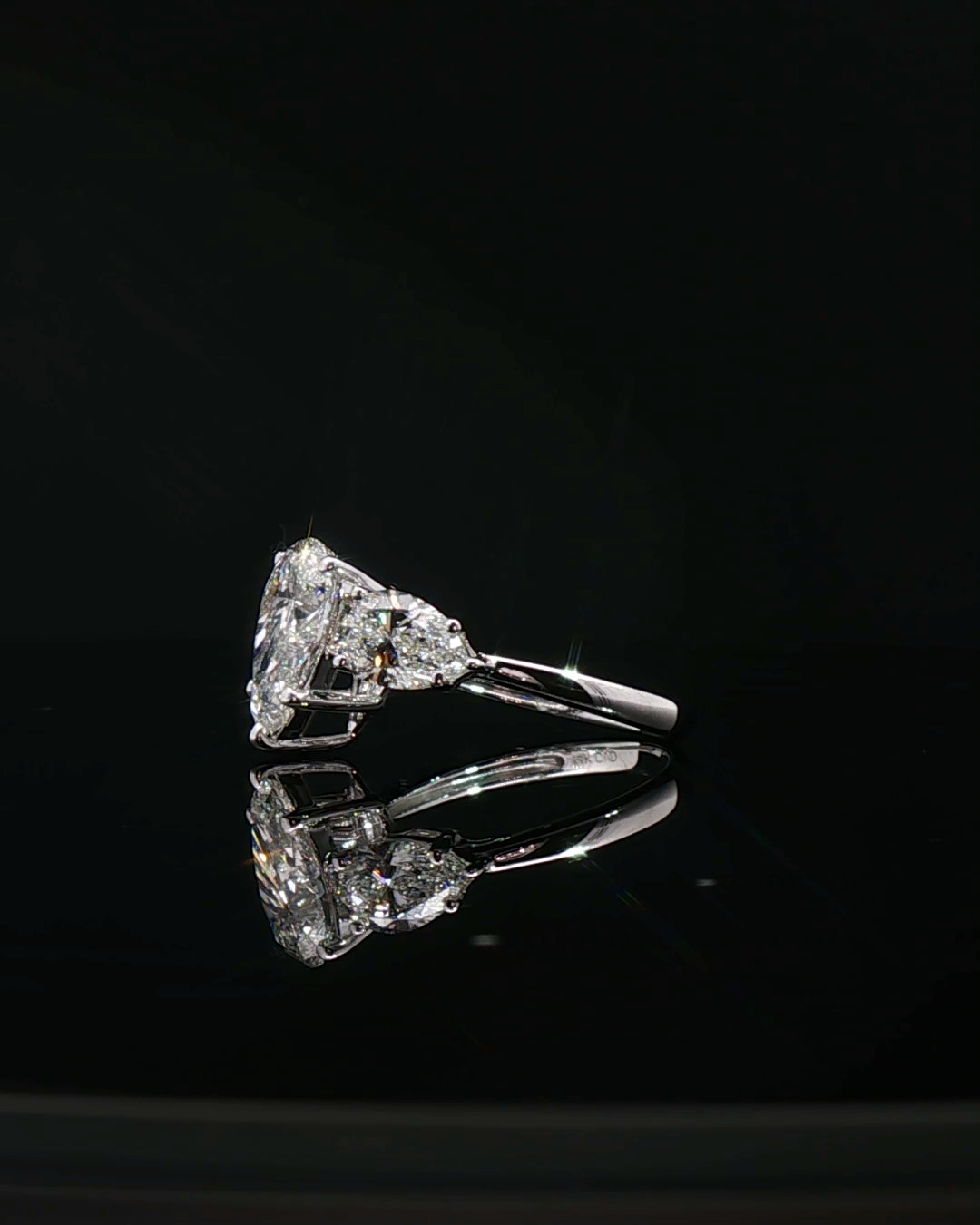 pear cut diamond multistone custom engagement ring platinum side view