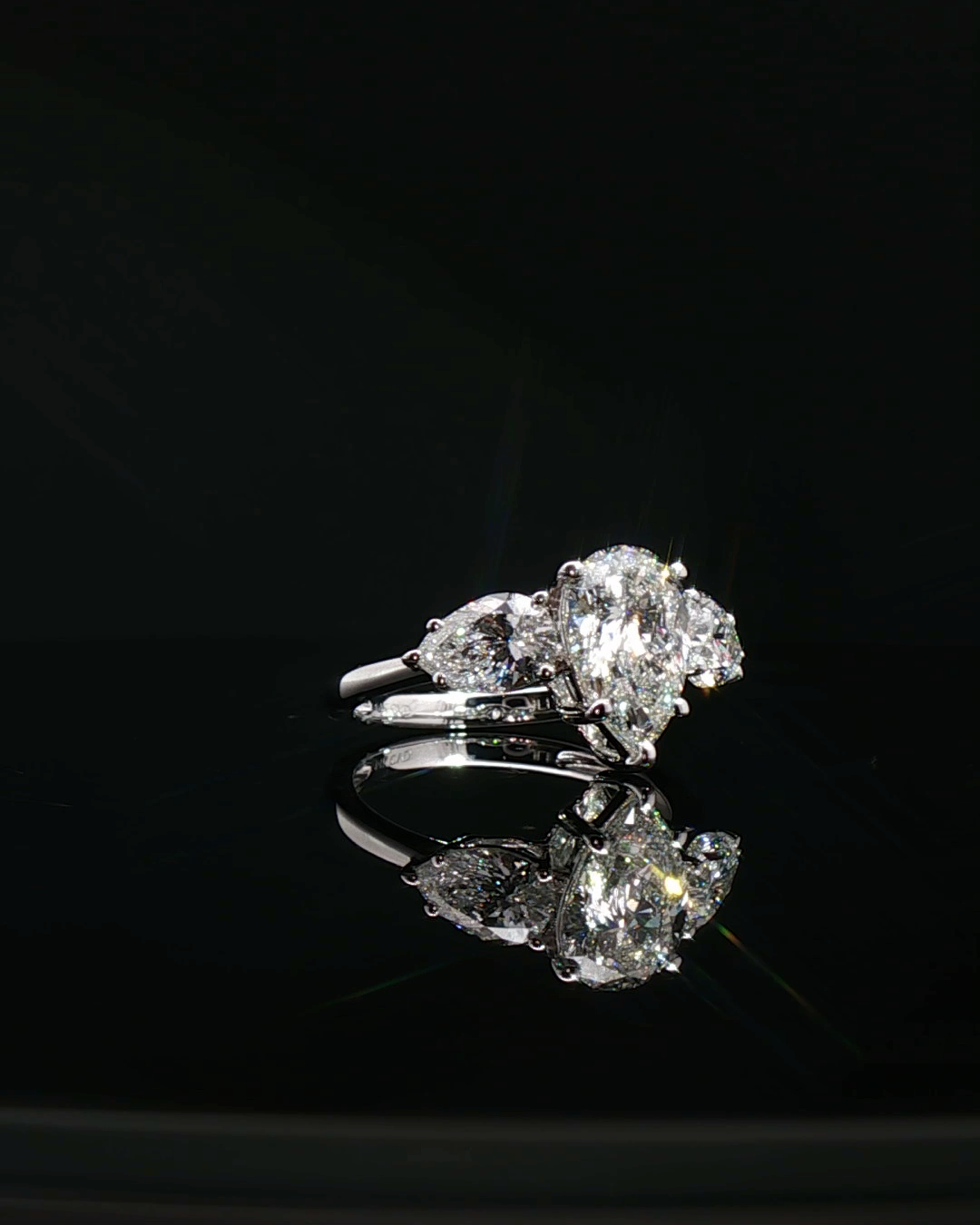 pear cut diamond multistone custom engagement ring platinum detail view