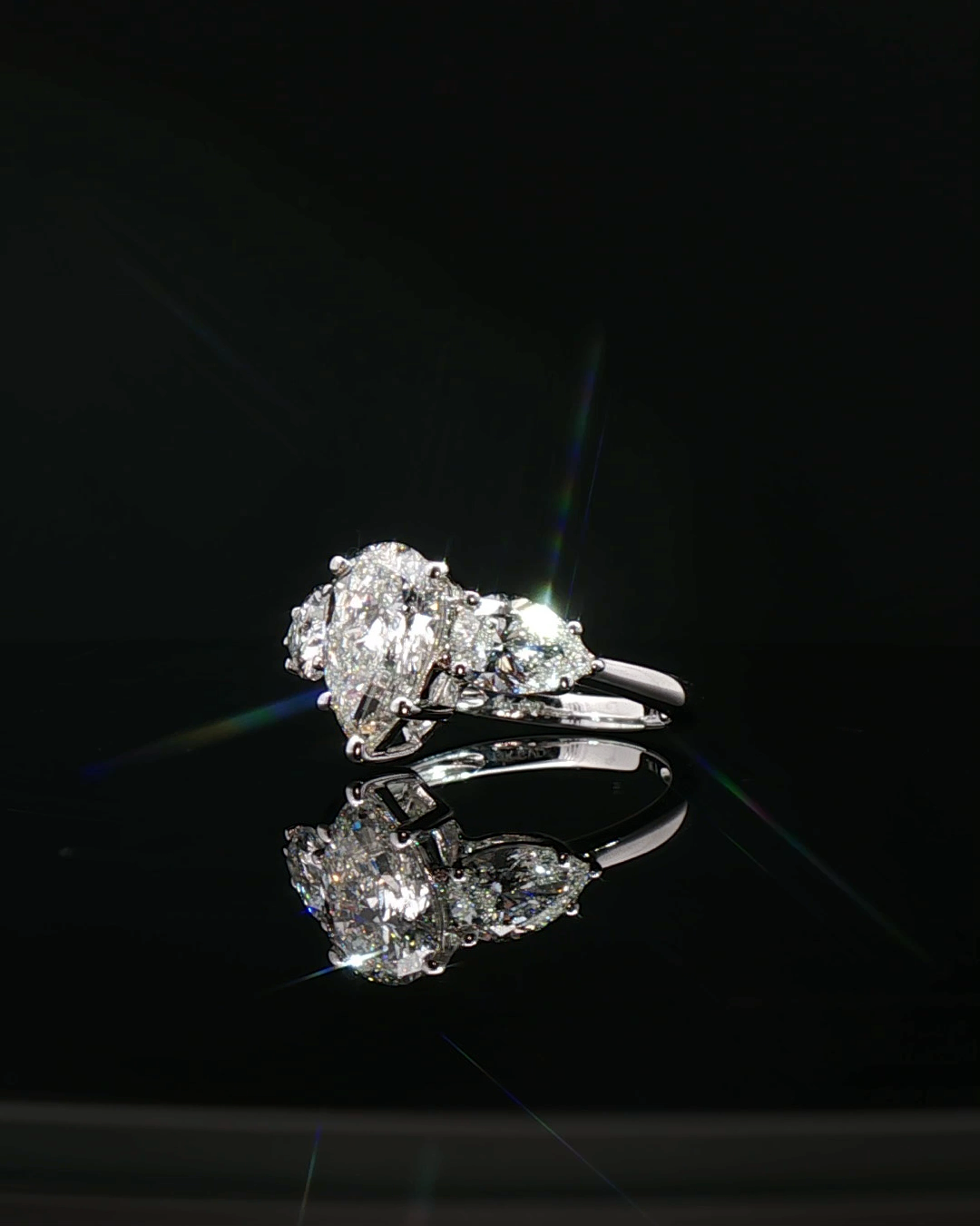 pear cut diamond multistone custom engagement ring platinum white gold side