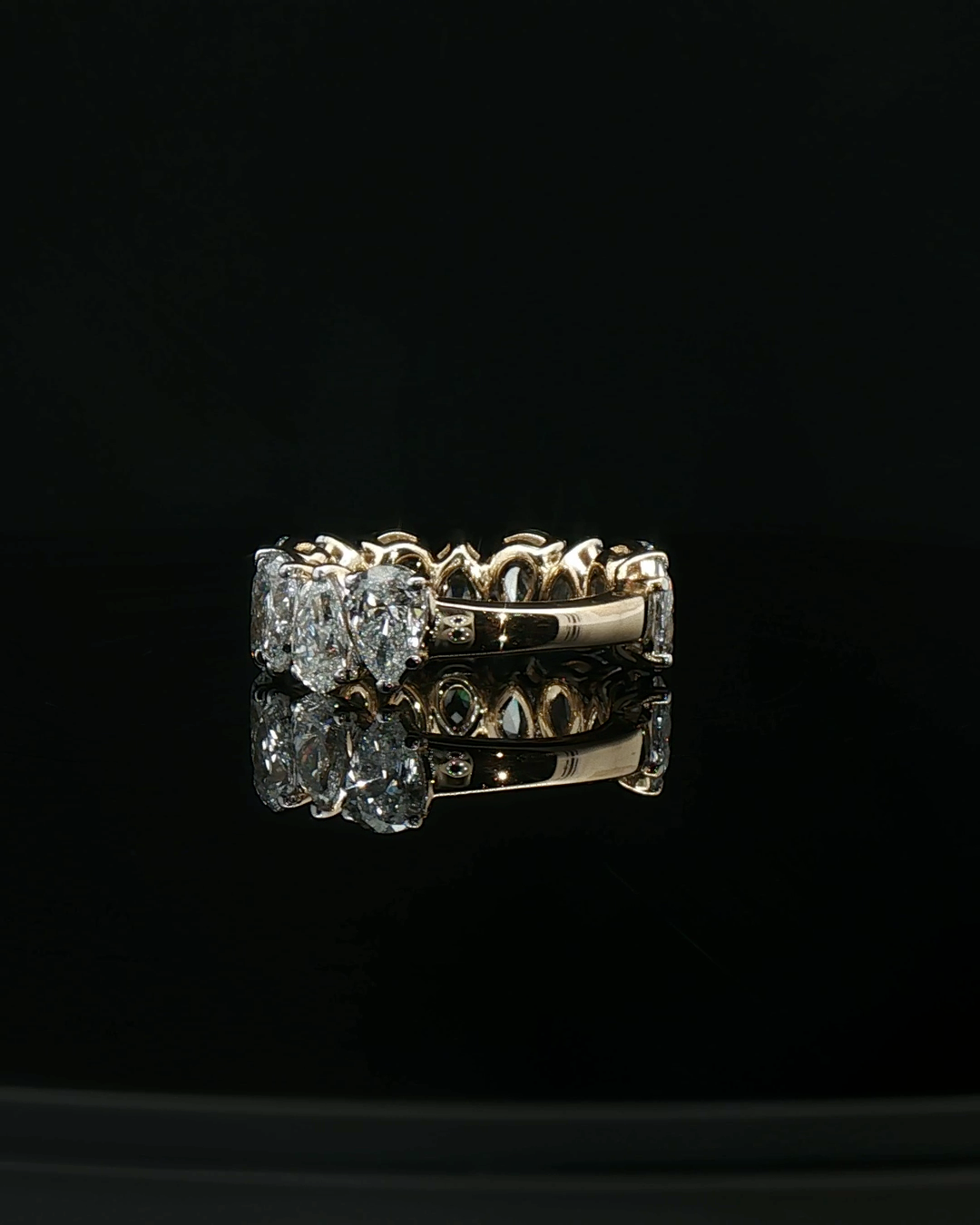 Yellow Gold Eternity Ring with Pear-Shaped Brilliant Cut Diamonds