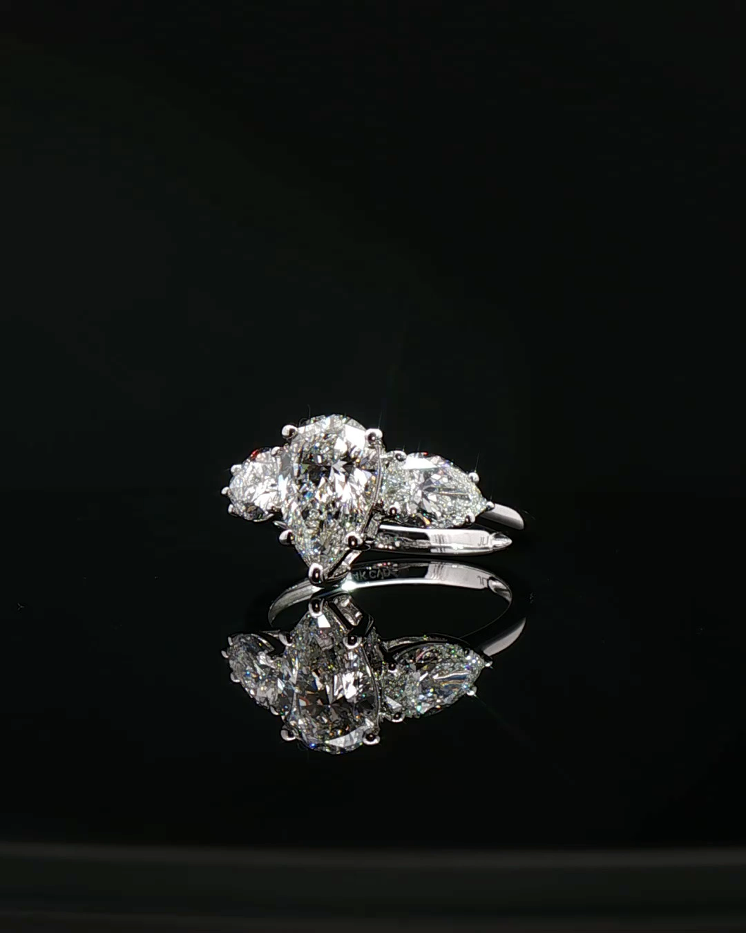 pear cut diamond multistone custom engagement ring platinum front view