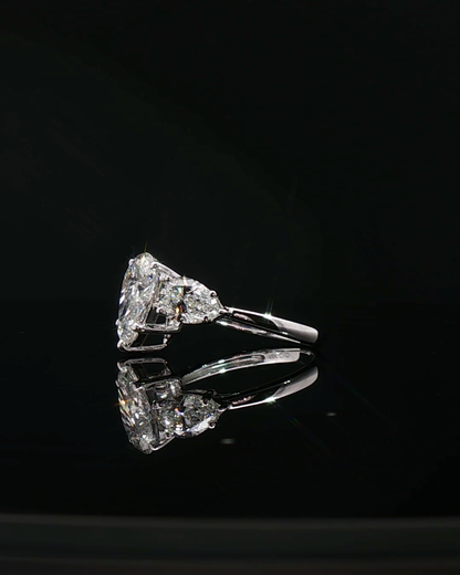 pear cut diamond multistone custom engagement ring platinum side view