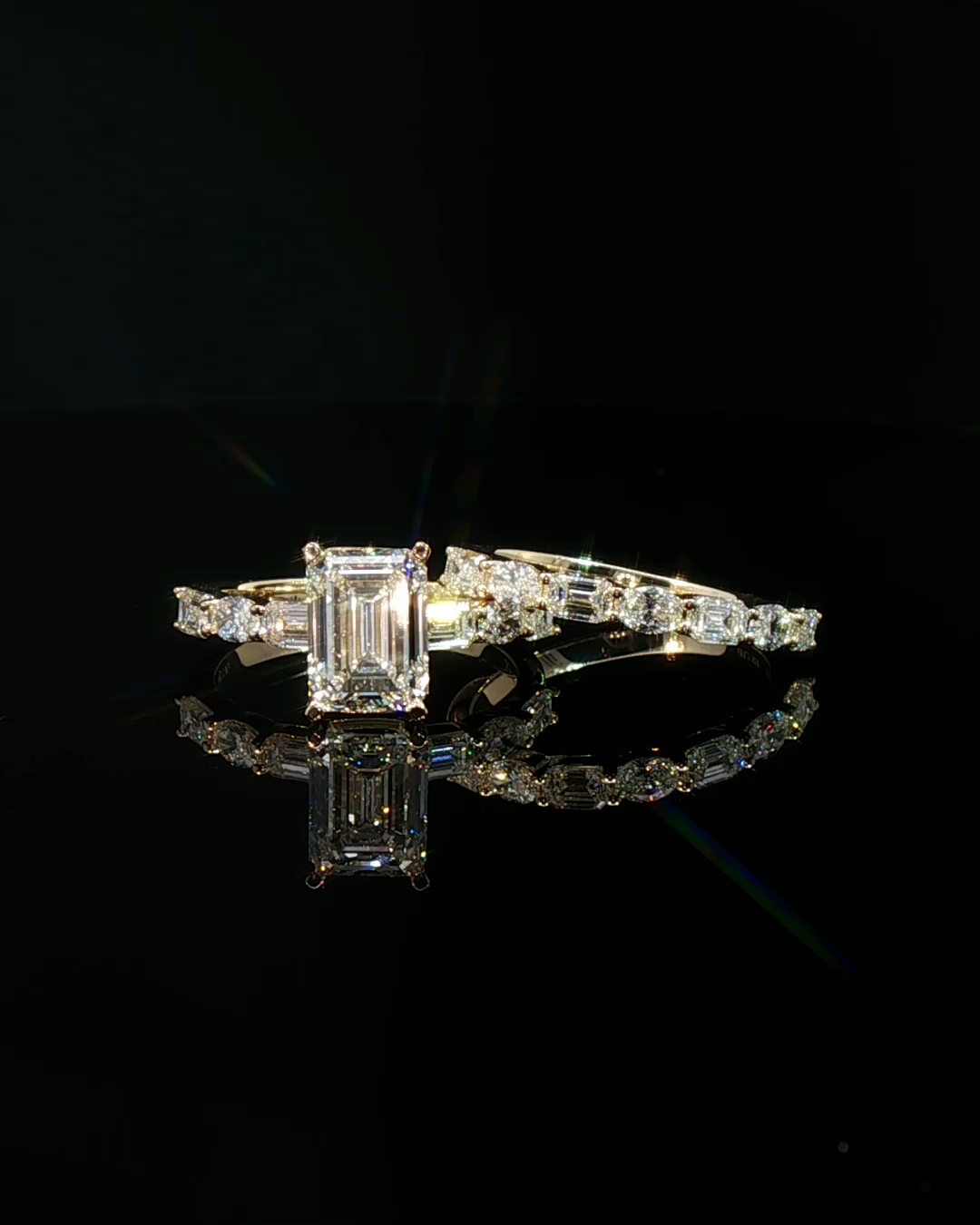 emerald cut diamond multistone custom engagement ring yellow gold front