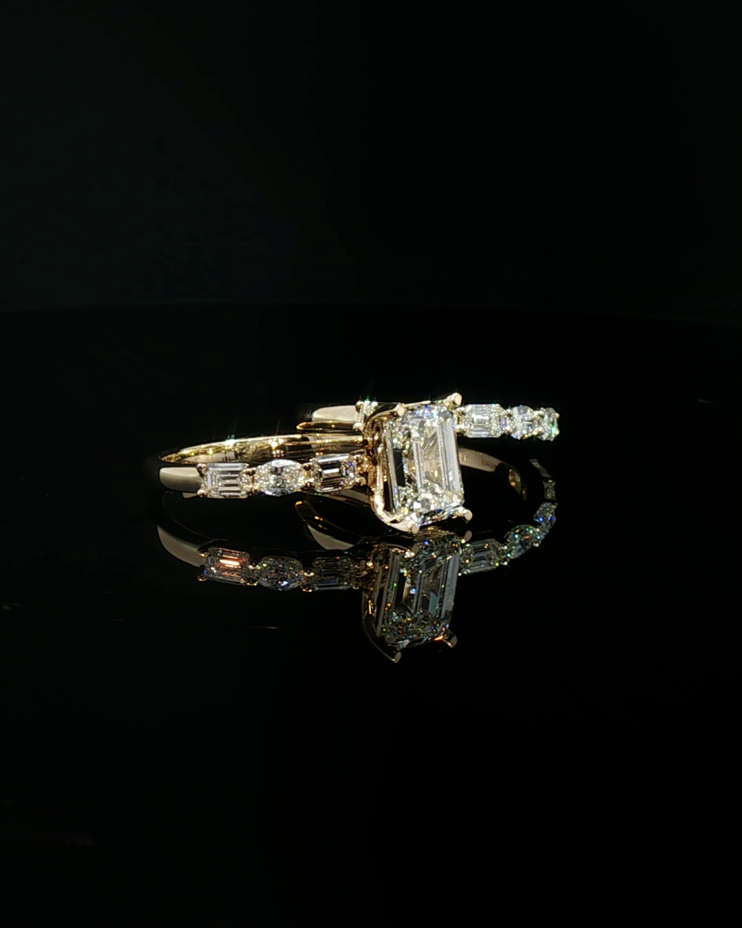 emerald cut diamond multistone custom engagement ring yellow gold detail