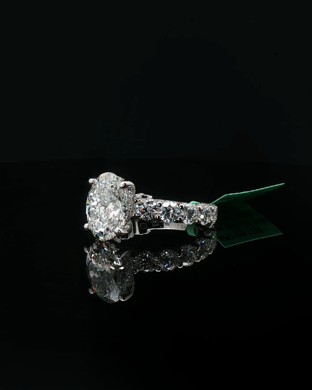 Platinum Multistone Ring with Oval Cut Diamond