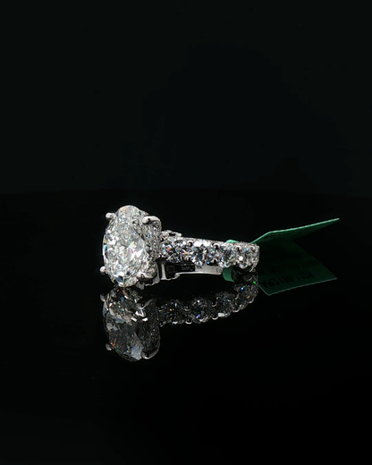 Platinum Multistone Ring with Oval Cut Diamond