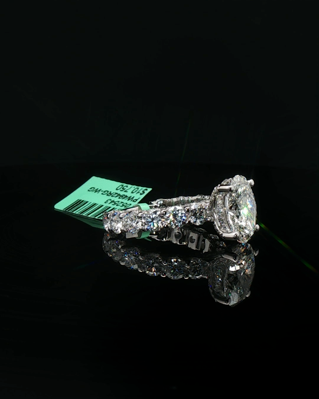 Platinum Multistone Ring with Oval Cut Diamond