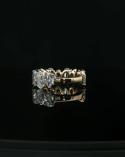 Yellow Gold Eternity Ring with Pear-Shaped Brilliant Cut Diamonds
