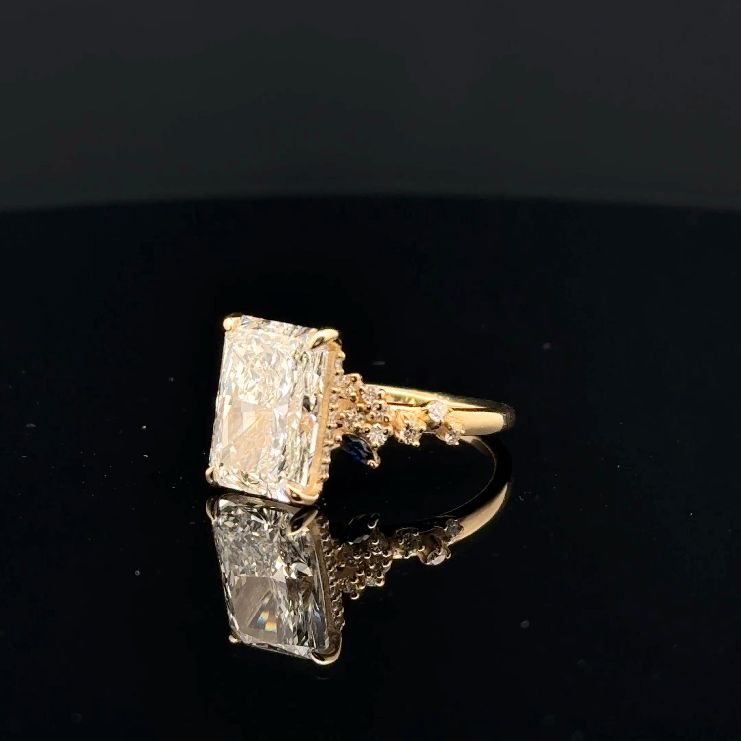 emerald cut diamond multistone custom engagement ring yellow gold front view